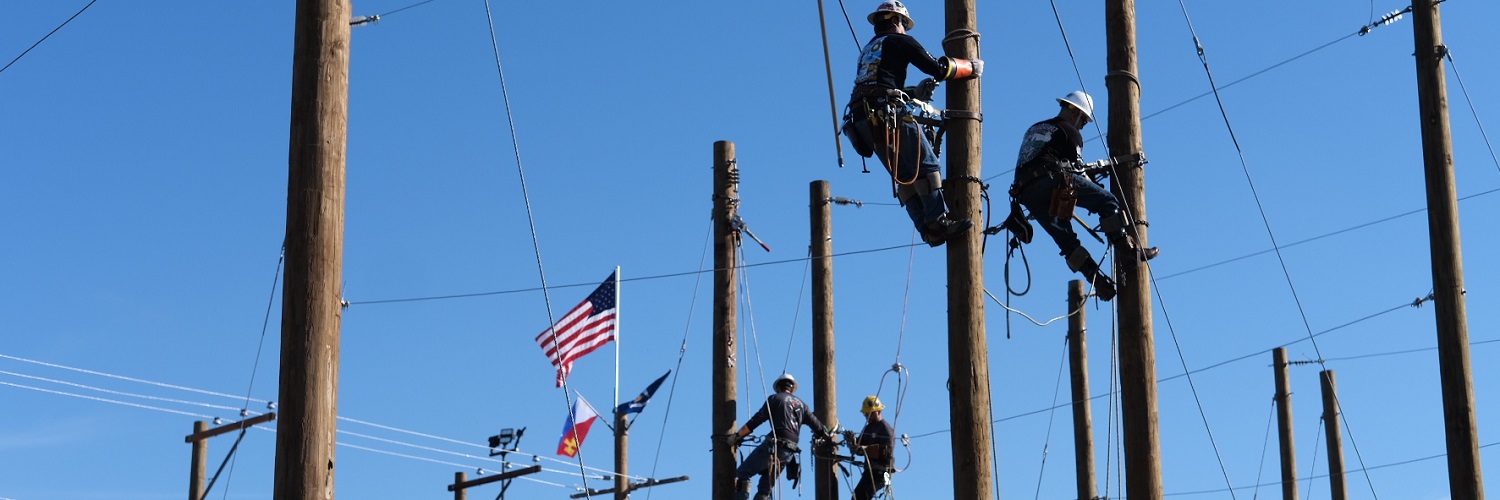 Lineworkers climbing polls at the Lineworkers Rodeo