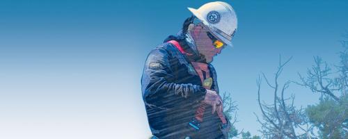 Utility worker using a safety harness